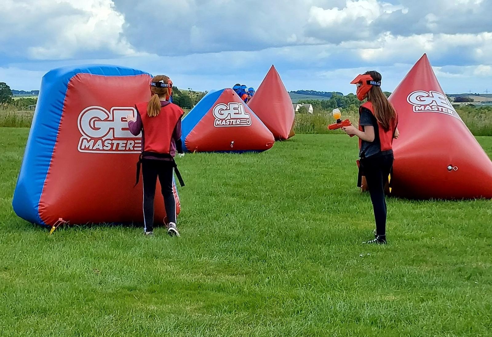 Children taking part in an activity session on the sports field